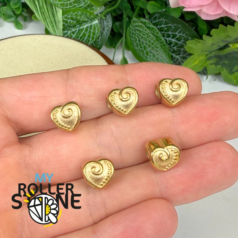 Perla en forma de corazón con espiral dorada