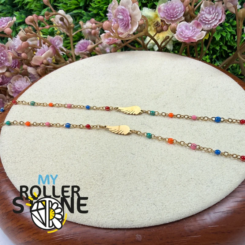 Pulsera con alas de ángel en acero inoxidable y esmalte multicolor.