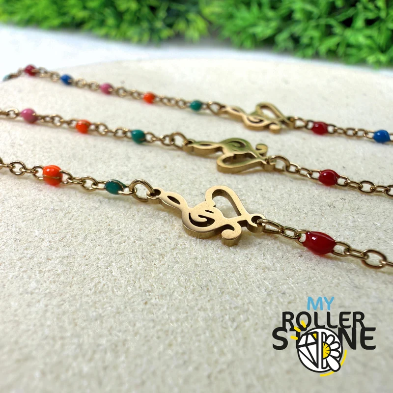 Pulsera de acero inoxidable con clave de sol y corazón
