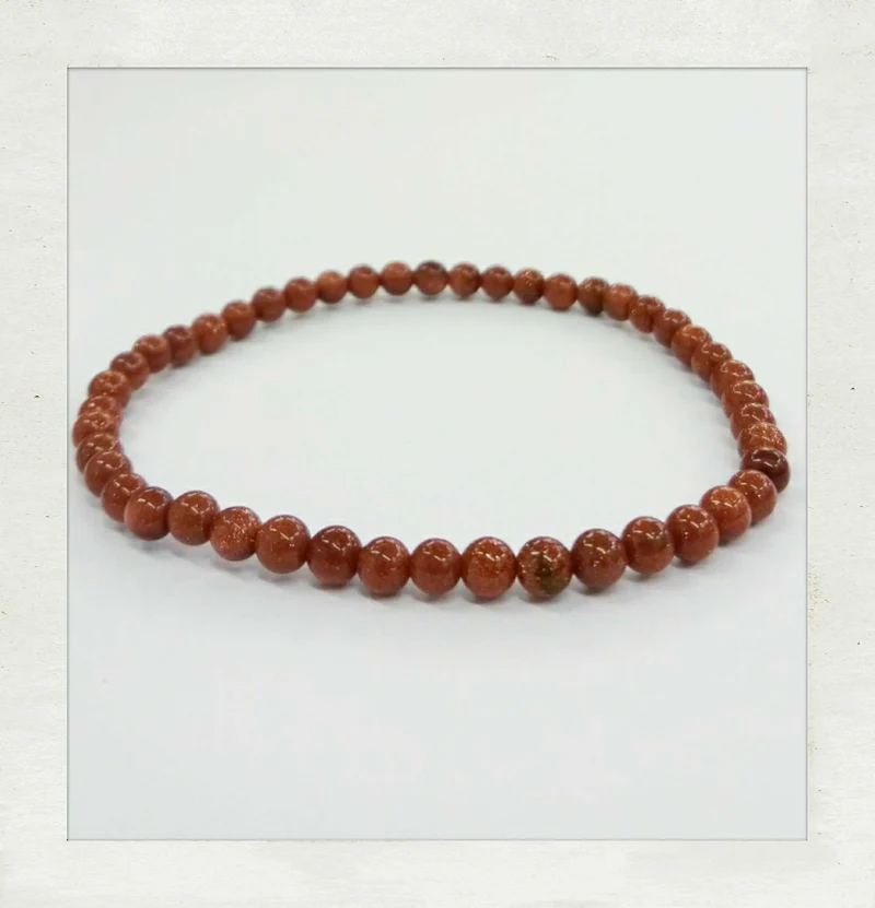 Pulsera de goldstone (sintético) (Bola de 4 mm.)