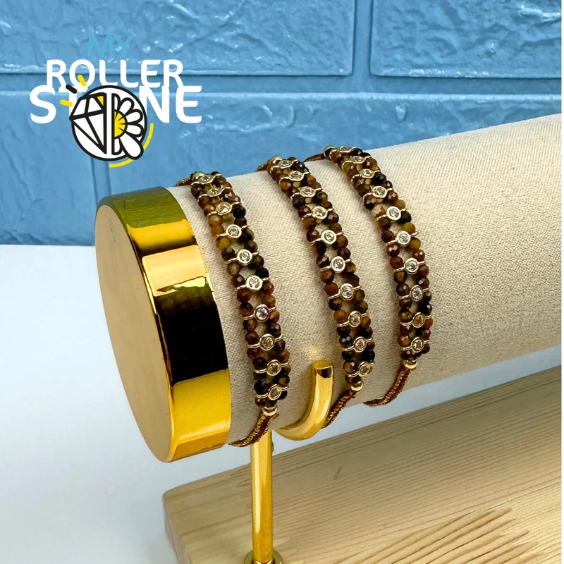 Pulsera trenzada con perlas naturales y diamantes de imitación.