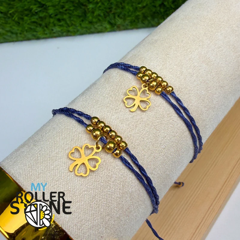 Pulsera con trébol de cuatro hojas, cordón encerado, acero inoxidable.