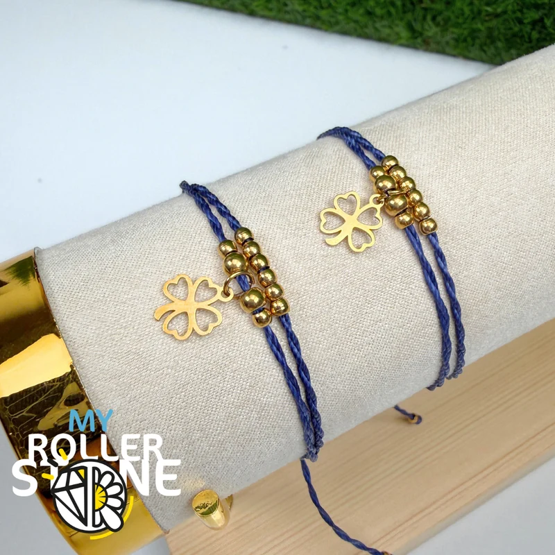 Pulsera con trébol de cuatro hojas, cordón encerado, acero inoxidable.