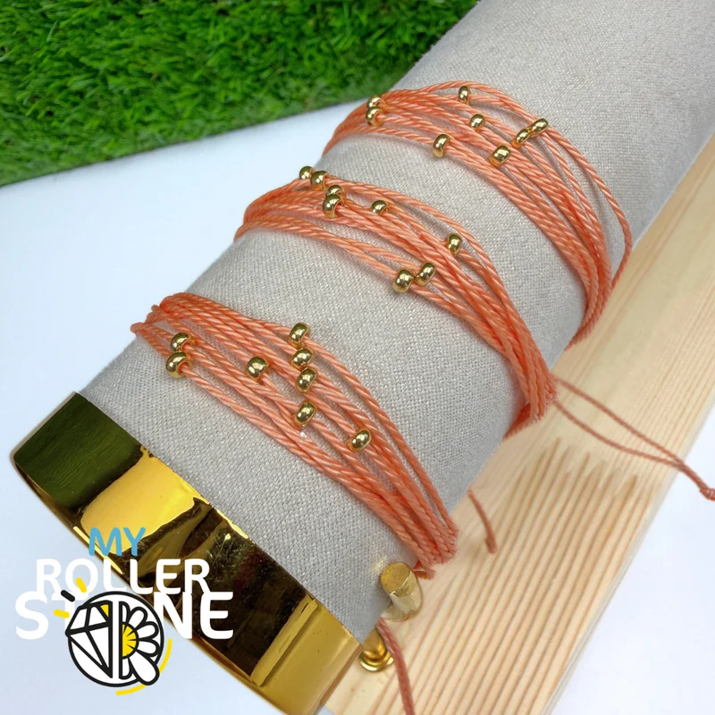 Pulsera de cordón encerado naranja con cuentas