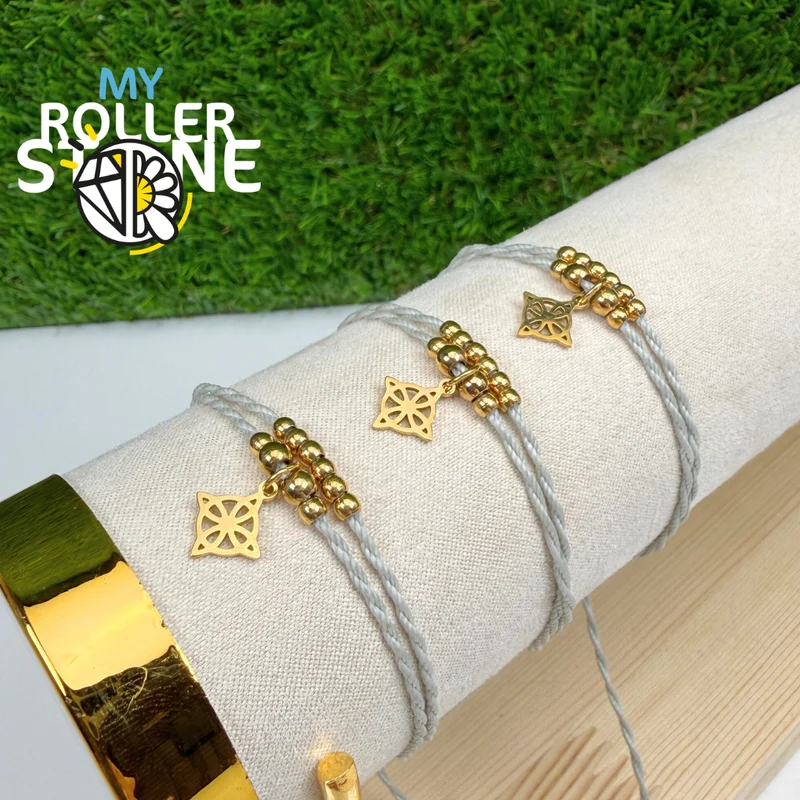 Pulsera con nudo de bruja, cordón encerado, acero inoxidable